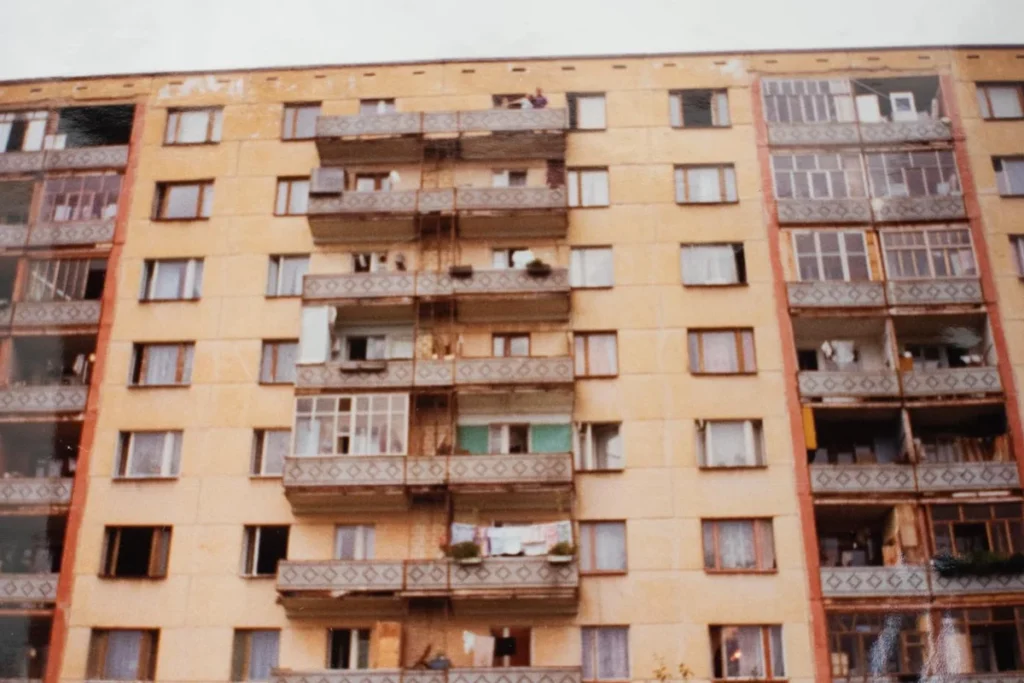 Soviet-era apartment block with balconies and hanging laundry in Izhevsk, Russia