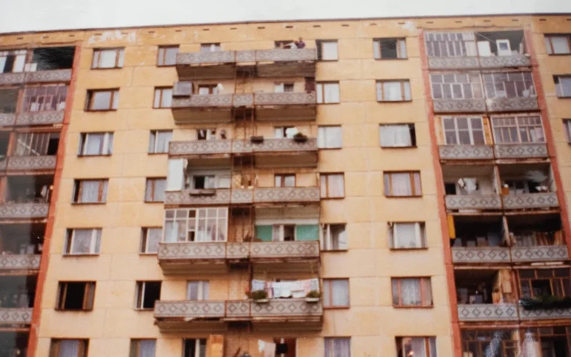 Soviet-era apartment block with balconies and hanging laundry in Izhevsk, Russia