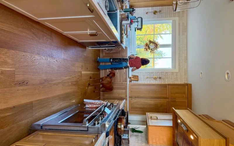 Cozy kitchen with fall colors visible through the window