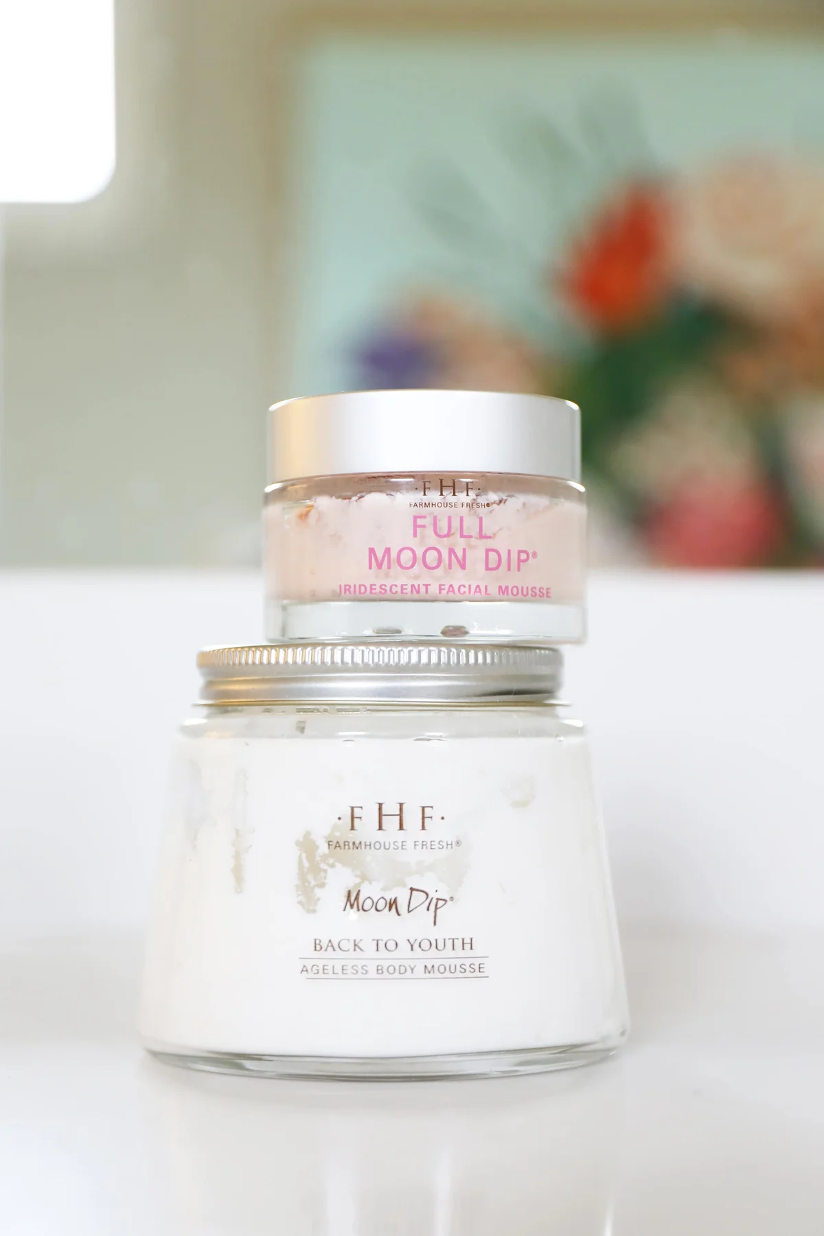Farmhouse Fresh facial and body mousse jars on white surface
