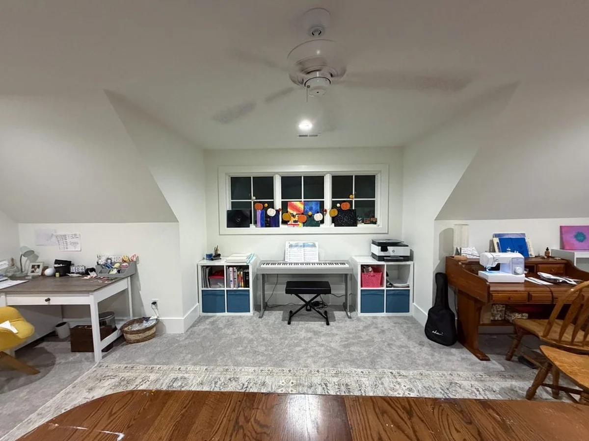 Organized creative room with tidy shelves and craft supplies
